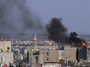 A handout image released by the Syrian opposition's Shaam News Network on June 16, 2012 shows smoke rising following shelling by government forces on the Khalidiyah neighbourhood of the restive city of Homs. AFP/Handout