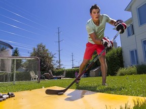 Top prospect Cody Ceci poses for a portrait at his Orleans home in advance of the NHL Draft. (ERROL MCGIHON THE OTTAWA SUN)