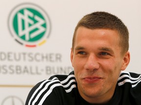 Germany's national soccer player Lukas Podolski smiles during a news conference before their their Euro 2012 soccer match against Denmark in Gdansk, June 15, 2012. (Thomas Bohlen/REUTERS)