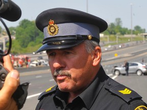 OPP Sgt. Dave Woodford talks to the media after a horrific crash on Hwy. 401 just east of Port Union Rd. killed a man in his 30s, left his wife fighting for her life and his three kids with minor injuries. (Chris Doucette/QMI Agency)