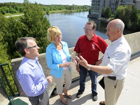 Simcoe North MP Bruce Stanton, Haliburton-Kawartha Lakes-Brock MPP Laurie Scott, Haliburton-Kawartha Lakes-Brock MP Barry Devolin and Northumberland-Quinte West MP Rick Norlock discuss their notes following a roundtable meeting on new revenue options to back proposed cuts to the Trent Severn Waterway during this meeting in the summer. 
QMI Agency file photo