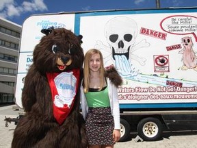 Last year, Dominique Coutu, a Grade 8 student at Ecole Felix-Ricard in Sudbury, stands near her first place winning poster for the annual Fast Flowing Water Poster Contest with Millie the Muskrat. The contest was created following the death of Adam Dickie, who drowned in Junction Creek in August 2007. The purpose of the competition is to create awareness and to promote safety around fast flowing water. JOHN LAPPA/THE SUDBURY STAR/QMI AGENCY