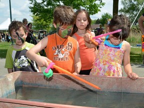 Children try their luck and patience as the participate in a fishing game on Saturday June 9, 2012 during the 9th annual Family Fun Festival at Kelso Park in Owen Sound.