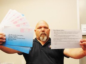In this file photo, USW Local 6500 president Rick Bertrand shows off some petition cards that were mailed to Labour Minister Linda Jeffrey.