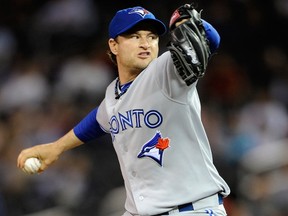 Jason Frasor set the Jays' career record for appearances by a pitcher last year and has been part of the team for the past nine years, save for a two-month stretch last season with the White Sox. (HANNAH FOSLIEN/Getty Images/AFP file photo)