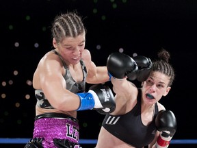 Edmonton’s Jelena Mrdjenovich rocks Oshawa’s Lindsay Garbatt with a straight right seconds before scoring a first-round KO to win the World Boxing Council’s vacant featherweight title in March. Mrdjenovich takes on Belinda Laracuente of New York in a non-title eight-rounder Friday at the Shaw Conference Centre. (Ian Kucerak, Edmonton Sun file)