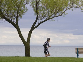 A jogger along the Beaches boardwalk on May 18, 2008. (QMI Agency/ERNEST DOROSZUK)