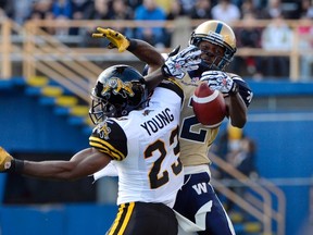 Edwards, catching a pass in front of Hamilton’s Marcell Young during Wednesday’s pre-season game, has vowed to be more of a vocal leader as the elder statesman among Bomber starters.