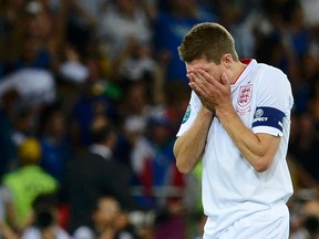 England midfielder Steven Gerrard reacts to after losing to Italy in their Euro 2012 quarterfinal match at the Olympic Stadium in Kiev, Ukraine, June 24, 2012. (NIGEL RODDIS/Reuters)