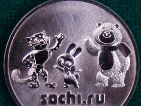 A coin to commemorate the Olympic mascots for the Sochi winter Olympics is seen during a presentation in Peter and Pawel Fortress in St. Petersburg February 21, 2012. The bank of Russia on Tuesday presented a series of commemorative coins devoted to the XXII Olympic winter games to be held in Sochi in 2014. REUTERS/Alexander Demianchuk