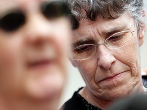 Audrey Creelman,(right) the mother of murder-victim Jean Rock, listens as family speaks to the media outside the Ottawa Courthouse after serial-killer Camille Cleroux's sentencing hearing Tuesday, June 26, 2012.  (QMI AGENCY/DARREN BROWN)