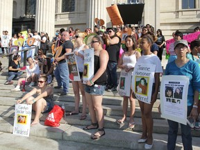 People take part in a political rally and vigil for missing and murder aboriginal women on Tuesday, June 26, 2012, at the Manitoba Legislature. (Jason Halstead/QMI Agency)