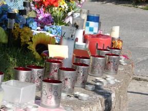 Candles line a ledge outside the Algo Centre Mall in Elliot Lake on Tuesday, June 26, 2012. Rescue officials have decided to resume efforts to clear debris inside the mall using equipment instead of allowing rescuers in the mall. JOHN LAPPA/THE SUDBURY STAR/QMI AGENCY