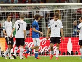 Germany's players react at the end of their Euro 2012 semifinal soccer match against Italy at the National stadium in Warsaw, June 28, 2012. (REUTERS)