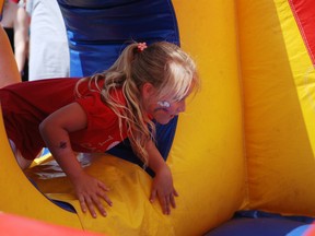 Julee Jasmin,7,  has fun on the inflatable opstacle course during the Canada Day festivities on Sunday. ERIKA GLASBERG/CORNWALL STANDARD-FREEHOLDER/QMI AGENCY