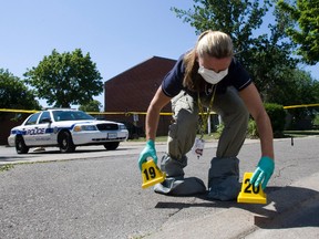 Peel  Regional Police Det. Wendy Sims at the scene where a shooting victim suffered fatal wounds. He was pronounced dead at hospital.
(STAN BEHAL, Toronto Sun)
