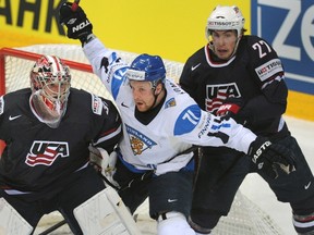 Maple Leafs prospect Leo Komarov (centre) played for Finland at this year's world ice hockey championship. (AFP/Files)