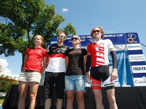 Sarah-Anne Brault, left, stands on stage with fellow triathletes Kyle Jones, Flora Duffy and Tim Don during a press conference at Hawrelak Park. (Ian Kucerak, Edmonton Sun)