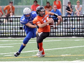 Sudbury Gladiators defender Joseph Jelen, left, tackles Peterborough Wolverines ball carrier Dylan Astrom during OFC junior varsity action at James Jerome Sports Complex on Saturday. Final score was tied, 42-42.