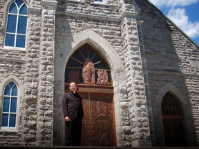 Bishop Marcel Damphousse stands outside the Co-Cathedral of the Nativity