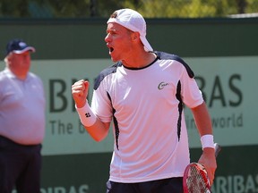 Australia's Lleyton Hewitt celebrates after winning a point against Slovenia's Blaz Kavcic during their men's singles first round tennis match of the French Open tennis tournament at the Roland Garros stadium. (Jacques Demarthon/AFP)