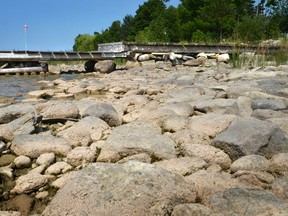 A dock along Owen Sound Bay comes up short in receding water levels in this June 2013 picture. But levels are up 37 centimetres over this time last year. Upcoming public meetings will discuss concerns that higher water levels are a blip.