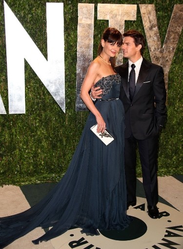 Event: Vanity Fair Oscar Party in West Hollywood     Year:  2012    Grade: A   By February 2012, the couple had red carpet dressing down pat. Katie's richly hued Elie Saab gown looked perfectly stunning. And see how Tom's tiny white pocket square balances his wife's lightly hued clutch? That's not by accident.  (Brian To/WENN.com)