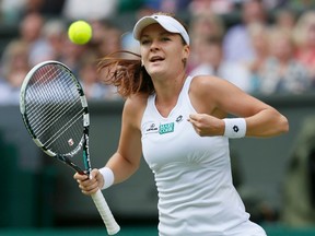 Agnieszka Radwanska celebrates after defeating Angelique Kerber in their Wimbledon semifinal match in London on Thursday, July 5, 2012. (Stefan Wermuth/Reuters)