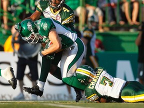 Eskimos slotback Adarius Bowman helped tackle Riders’ safety Craig Butler, but ended up tearing his MCL and ACL on his left leg on the play, putting him out for the season. (Reuters)