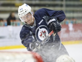 First-round draft pick Jacob Trouba takes part in a drill at the Jets' development camp Monday. (SEBATIEN PERTH/QMI Agency)