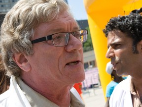 Canadian Doctors for Refugee Care, including Dr. Philip Berger, chief of family medicine at St. Michael’s Hospital, protested a Pan Am Games announcement in Toronto on Tuesday. (Dave Thomas/Toronto Sun)