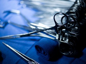 Clamps, scissors and other surgical instruments are seen in this file photo. (AFP PHOTO/BRENDAN SMIALOWSKI)