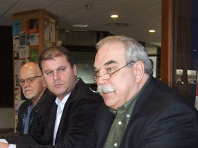 President Dan Melanson, foreground, of the Greater Sudbury Taxpayers Association. Also in photo are Ron MacDonald, background, and Paul Demers.