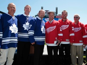Members of the Toronto Maple Leafs alumni  (L-R) Jim McKenny, Kevin Maguire and Wendel Clark pose with members of Detroit Red Wings alumni Dino Ciccarelli, Joe Kocur, Alex Delvecchio and Ted Lindsay during a news conference to announce preliminary rosters for the 2012 Maple Leafs vs. Red Wings Alumni Showdown hockey game on December 31st at Comerica Park in Detroit, Michigan July 11, 2012.    REUTERS/Rebecca Cook