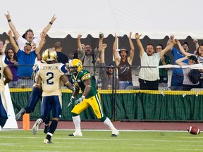 Hugh Charles ran the ball against the Blue Bombers Friday at Commonwealth Stadium, but he also caught three passes, including one for a touchdown. (Amber Bracken, Edmonton Sun)