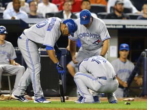 Blue Jays batter Jose Bautista hurts his wrist after a foul ball during a game against the Yankees at Yankee Stadium in New York, N.Y., July 16, 2012. (AL BELLO/Getty Images/AFP)