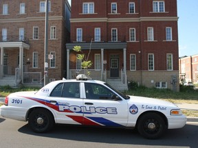 Police enter a townhouse complex on Thursday, July 12, 2012. A unknown woman woke to find an intruder in her home on Assinboine  Rd. (Veronica Henri/Toronto Sun)