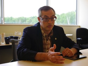 Tony Clement, president of the Treasury Board and minister responsible for FedNor, speaks to reporters at the Sault Ste. Marie Innovation Centre on Tuesday, July 17, 2012, in Sault Ste. Marie, Ont. (QMI Agency/MICHAEL PURVIS)