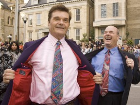 Fred Willard, left, and Larry Miller flash the crowd on red carpet at Roy Thomson Hall for film festival gala screening of " For Your Consideration (Stan Behal/QMI Agency)