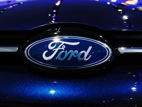 A Ford logo is seen on the front of a Ford Focus during the press days for the North American International Auto show in Detroit, Michigan, January 11, 2011. (Reuters/MARK BLINCH)