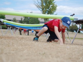 Ethan McLaughlin,5, races under pool noodles during the playground olympics hosted at Lamoureux Park in Cornwall (Postmedia Network file photo).