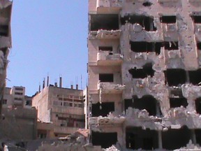 Damaged buildings are seen in Juret al-Shayah in Homs.  REUTERS/Shaam News Network/Handout