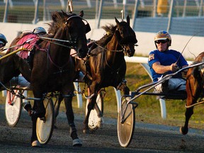 Horses and their drivers aprroach the finish line in the fourth race during the 40th anniversary of Kawartha Downs on Saturday, July 21, 2012. A deal has been reached to bring harness racing back this summer.
CLIFFORD SKARSTEDT/PETERBOROUGH EXAMINER/QMI AGENCY file photo