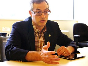 Tony Clement, president of the Treasury Board and minister responsible for FedNor, speaks to reporters at the Sault Ste. Marie Innovation Centre in this July 17, 2012 file photo. MICHAEL PURVIS/SAULT STAR/QMI AGENCY