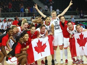 Canada's women's basketball team celebrates qualifying for the London Olympics.