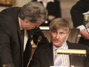 Coun. Bill Glover, seen here at right, speaks with Coun. Jim Neill, during a council meeting in 2012.
Whig-Standard