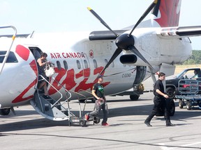 Passengers disembark from an Air Jazz flight Monday at Kingston's Norman Rogers Airport.
Ian MacAlpine/The Whig-Standard