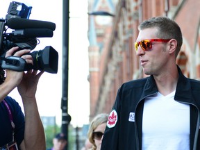 Canadian and Giro d'Italia champion Ryder Hesjedal arrives in London for the Olympics. (AL CHAREST/QMI AGENCY)