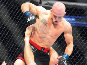 JIM WELLS QMI Agency
Sudbury's Mitch Gagnon (black trunks) fights Bryan Caraway during UFC 149 on Saturday in Calgary, Alta. Gagnon has agreed to fight Issei Tamura at UFC 158 in Montreal in March.