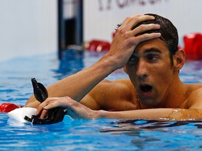 Michael Phelps reacts after racing in heat 4 of the men's 400-metre individual medley at the London 2012 Olympic Games at the Aquatics Centre in London, England, July 28, 2012. (MICHAEL DALDER/Reuters)